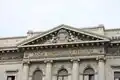 Coat of arms of Milan carved on the Palazzo della Banca Commerciale Italiana in Milan, which is located in Piazza della Scala