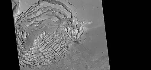 Large group of concentric cracks, as seen by HiRISE, under HiWish program. Location is Ismenius Lacus quadrangle. Cracks were formed by a volcano under ice.[137]