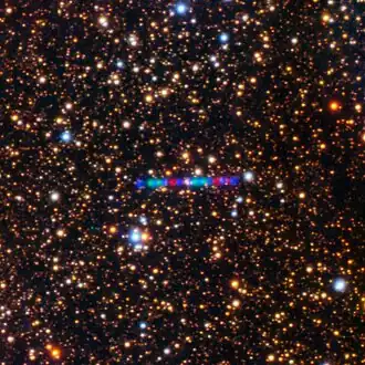 Movement across a field of stars, as seen by Gemini North. The colorful appearance of the comet's trail is due to the telescope changing light filters while observing the comet.