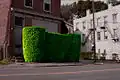 A living sculpture made and maintained by a resident artist