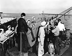 A Mk 21 5"/38 caliber open pedestal mount like the one on the stern of a Boulder Victory Class cargo ship.