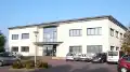 Photo of the facade of the two-storey building housing the current premises of ADCIS.