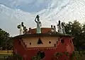 A well and replicas of village