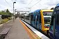 An Aboriginal liveried X'Trapolis 100 set at the station