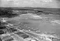 An aerial view of Seletar airfield, Singapore, with RAF Mosquito and Dakota I aircraft parked up