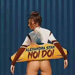 Shot of Stan with a blow-up banana in a beach setting.