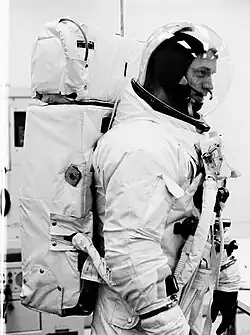 Spacesuited man with large backpack