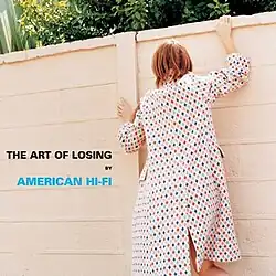 A woman attempting to climb a fence