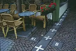 The border of Baarle-Hertog (Belgium) and Baarle-Nassau (Netherlands). Note the precision of the location of the Dutch café.