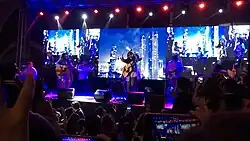 A group photograph of Ben&Ben performing