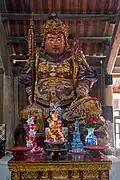 One of the 17th-century wood statues displayed inside the main building.