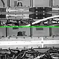 The CBM/CBM joint has provisions for installation of an IVA seal in case the primary seal fails. Like the primary, it is a segmented molded seal, but has beads only on the outboard face. The beads are squeezed against the inboard faces of the rings by compression plates, fastening into the same bolt pattern used to hold the protective covers.[6][4] The lower and upper images show the CBM/CBM joint with and without the secondary seal hardware installed, respectively.