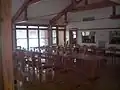 Dining hall facing kitchen.