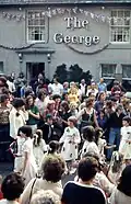 Dancing outside a pub