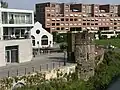 Céramique: View onto the 1990s/2000s built apartment blocks and a theatre housed in an older building (centre)