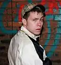 Image 44British "Chav" wearing tracksuit and baseball cap. (from 2000s in fashion)