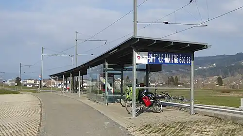 Station shelter next to railway track