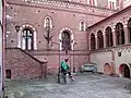a jester in the castle courtyard