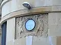 A relief with a build-in clock.