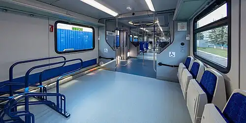 Designated areas for bikes/scooters and wheelchairs inside control car of Ivolga-1.0.