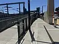 The south end ramps from Station Street leading to the lift and undercover pedestrian overpass, December 2024