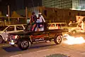Expatriates from the UAE, participating in the night parade of the Qatar National Day