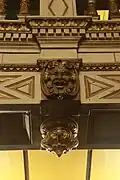 A face in the moldwork.
