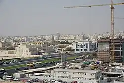 Fahad Bin Jassim Kidney Center at the corner of Mohammed Bin Thani Street (center, with the grass median) and Al Rasheed Street in the New Al Hitmi district of Doha, Qatar.