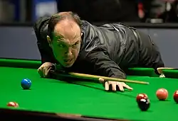 Image of O'Brien preparing to take a shot