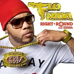 A black man with a short black beard standing in front of a white background. He wears a red cap, brown sunglasses, a white t-shirt with unrecognizable black text, a gold watch, and a gold chain. In the middle of the chain, the words "Poe Boy" are written in white on a red background with a small white microphone next to the text. Above this, the chain says "Born In" in white text on a gold background, and below, it says "Miami" in white text on a gold background. Next to the man's image, the words "Flo Rida" are written in gold text, with "Right Round" written in small red text below this.
