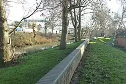 Flood defences: looking south on the east side of St James opposite Northampton station. The river runs north to south and is a tributary of the River Nene