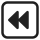 Two congruent black triangles pointing to the left