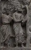 Gandhara harpist, bow harp, 100-300 A.D. Horizontal bow-harp, played with striker. The harp is being held on the neck, over the strings.