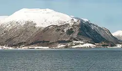The village is located along the shore of this peninsula