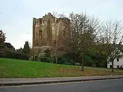 roofless stone castle keep in parkland