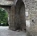 Recycled stones dating from antiquity used in the construction of the upper gate. One of the stones has a fragment of an ancient Greek inscription