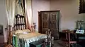 Recreation of a room of a criollo house with furniture of the time.