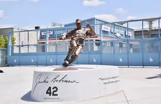 Bronze sculpture of Jackie Robinson on a graphite base