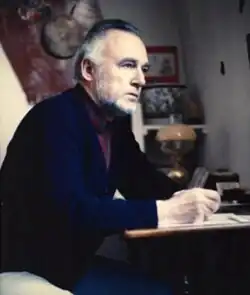 Breyer sitting at his desk