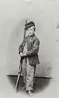Drummer boy Johnny Clem wearing sack coat and kepi