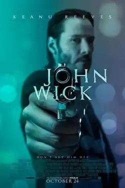 A man points a gun directly at the viewer. The film's title uses the gun barrel as an "O".