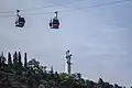 Statue with cable cars in the foreground
