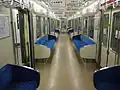 The interior of intermediate car 865 with longitudinal seating in July 2014