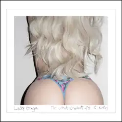 A close-up of female buttocks in a blue, floral thong.