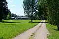 Lapkalnys village inside the forest