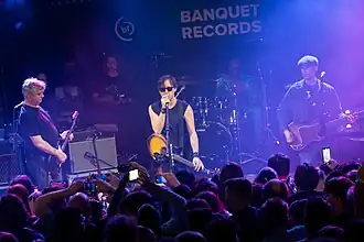 The Libertines performing in 2024 From left to right: Doherty, Barât, Powell (on drums), and Hassall