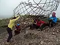 The team preparing to install the armature of the statue's face