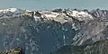 Little Devil Peak (right of center). Mount Shuksan in upper left corner, The Trapezoid in upper right corner.
