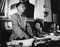Liu Shaoqi (left) wearing the suit, 1950