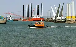 Image of harbour with windfarm construction